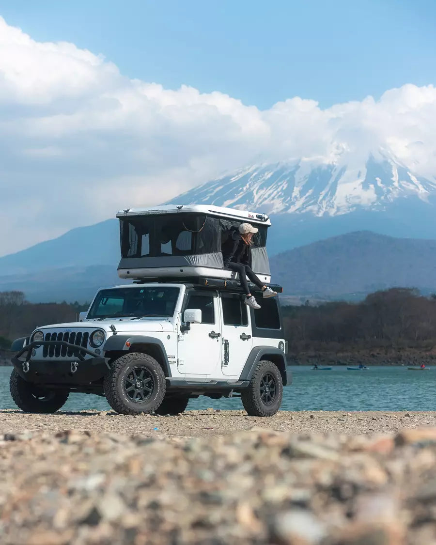 Hannah Price camping in front of Mount Fuji Japan with James Baroud rooftop tent
