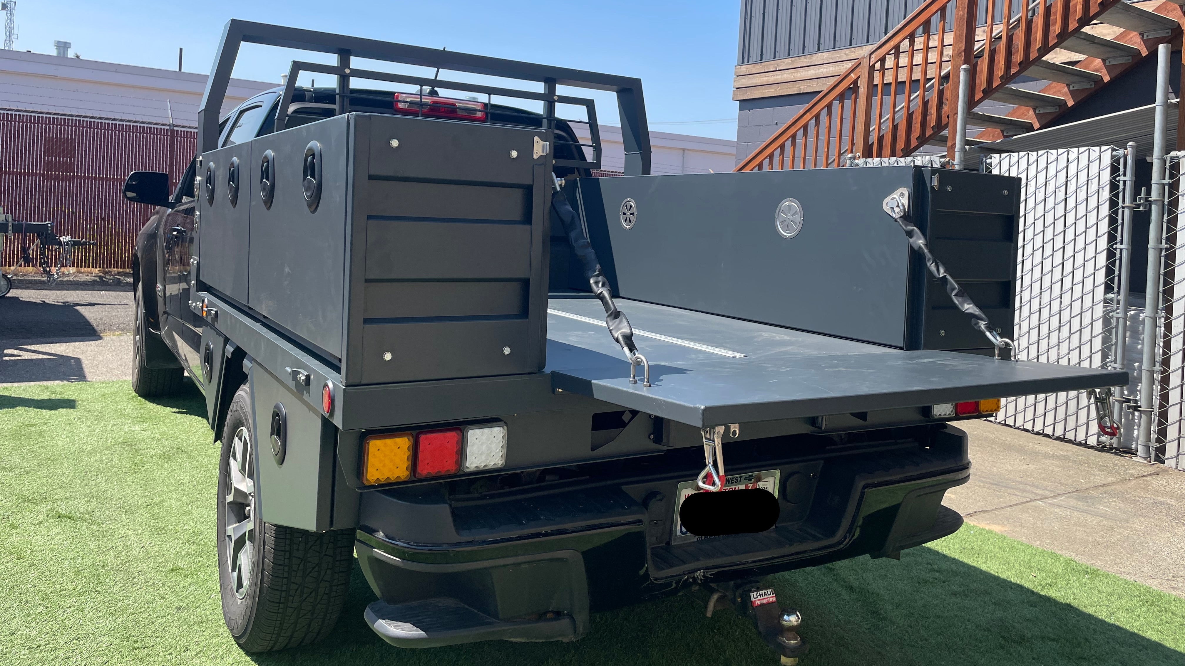 Truck with a flatbed and open tailgate